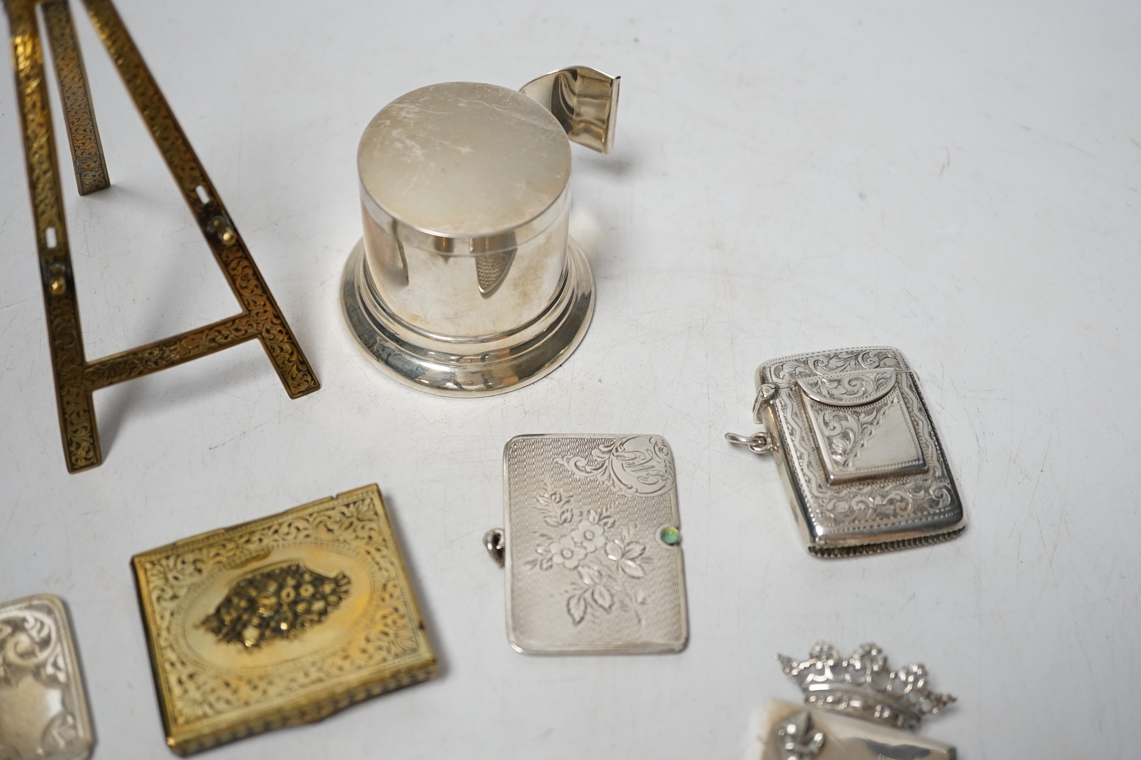 An Edwardian engraved silver combination stamp box/vesta case, Birmingham, 1906, 48mm, a similar silver slide action stamp case and seven other items including white metal box and sterling dispenser, etc.